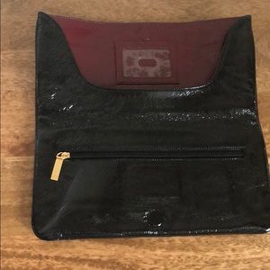 Black paten leather clutch